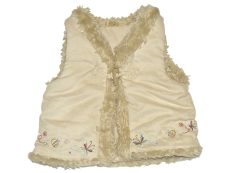 Mothercare, Hímzett, műirha mellény